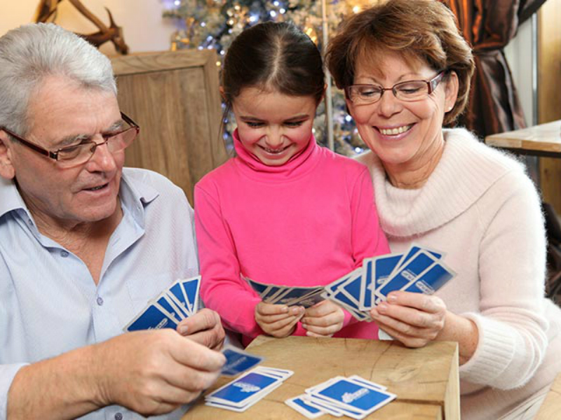 grandparents-playng-cards-with-granddaughter