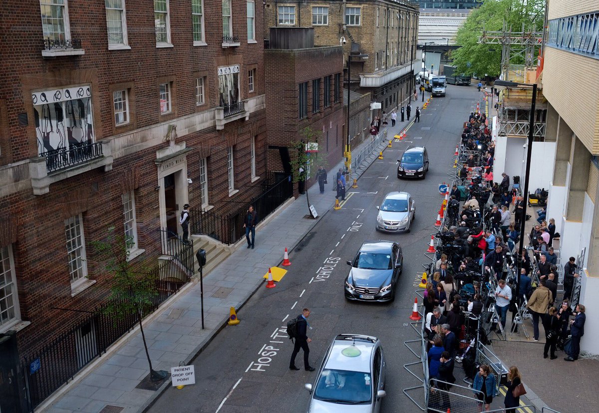 People waiting in front of the hospital 