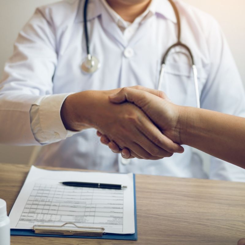 Doctor shake hands with patient