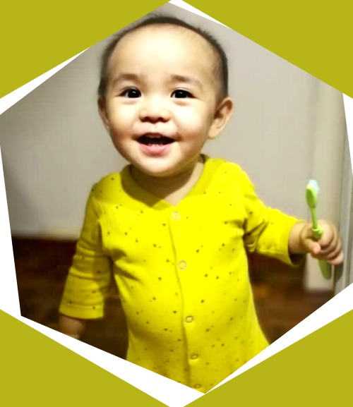 Dylan Yong loves brushing his eight baby teeth. (Image Credit: Jo Lee)