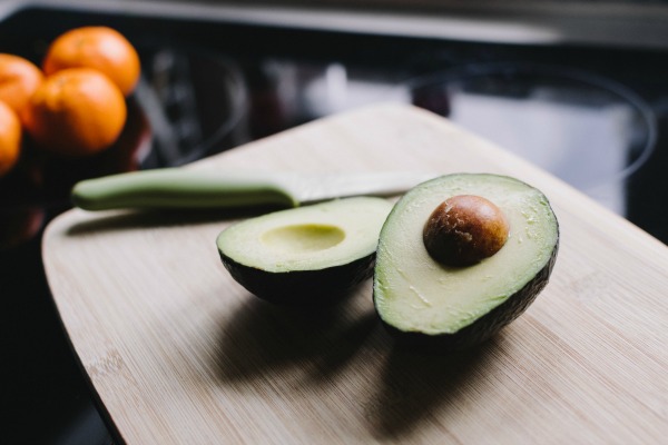 An opened avocado on chopping block. Easy Toddler Meals, Recipes Malaysia 