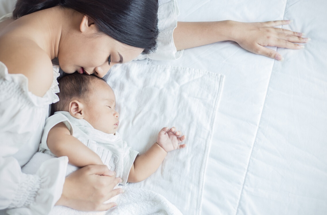 Mom sleeping outlet with newborn