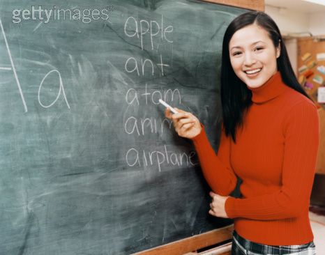 Teacher At Blackboard