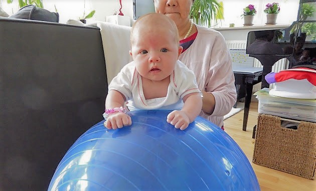 baby on a gym ball for tummy time