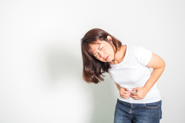 Asian Woman With Tummy Ache