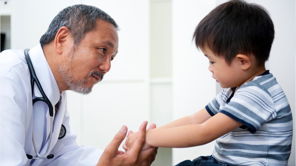 boy with doctor at child specialist clinic