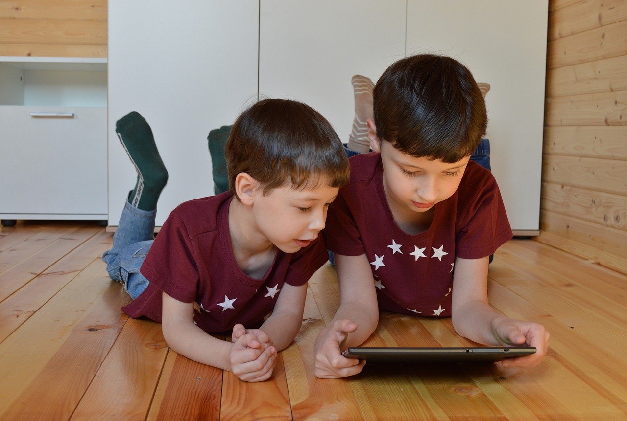 boys playing with smart devices