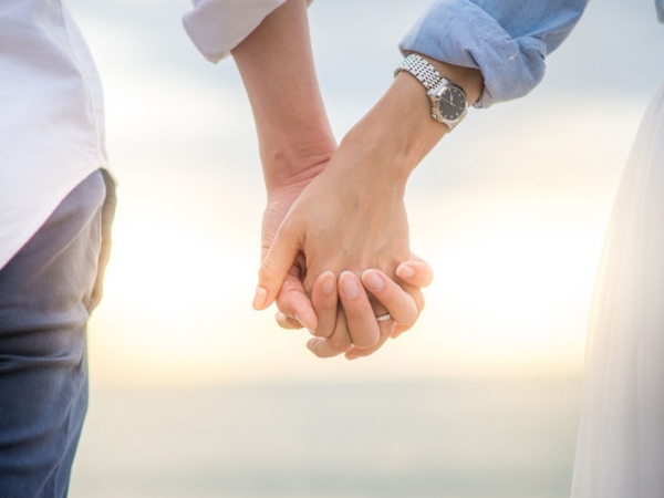 couple holding hands during marriage