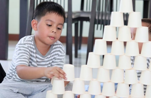Besides having fun with your children, they can also learn about balance and strategizing in the paper cup tower activity