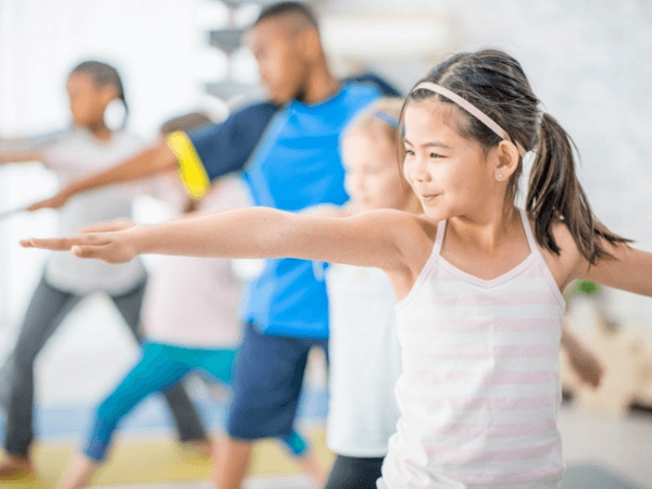 kids doing yoga as one of the relaxation activities