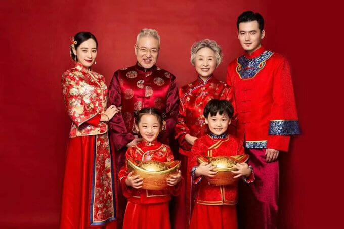 Chinese Family Wearing Red and Gold