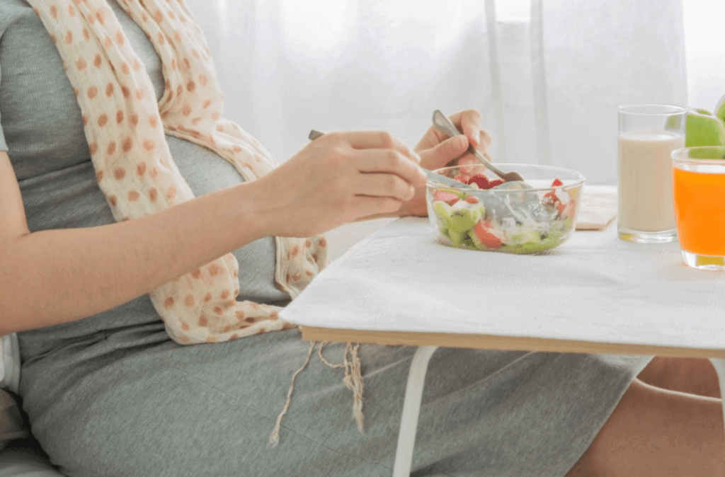 pregnant eating fruit salads