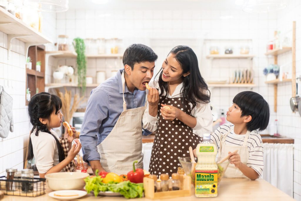 family cooking using Mazola™ Cooking Oils