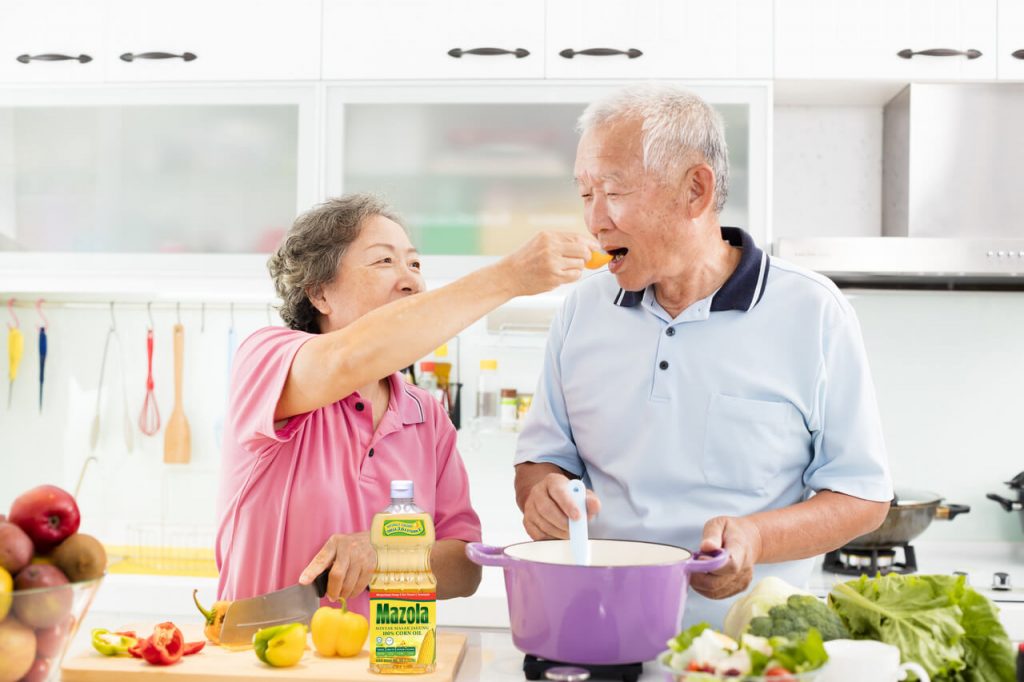 grandparents cook using Mazola™ Cooking Oils