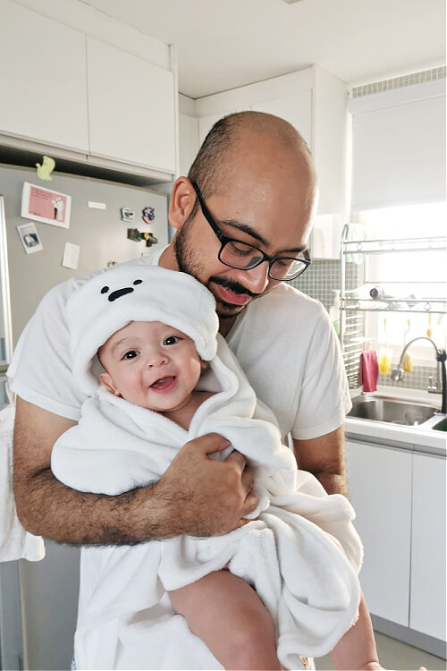 Newish daddy Hamzah after bathing son Gabriel for 3 Generations of Dads special feature