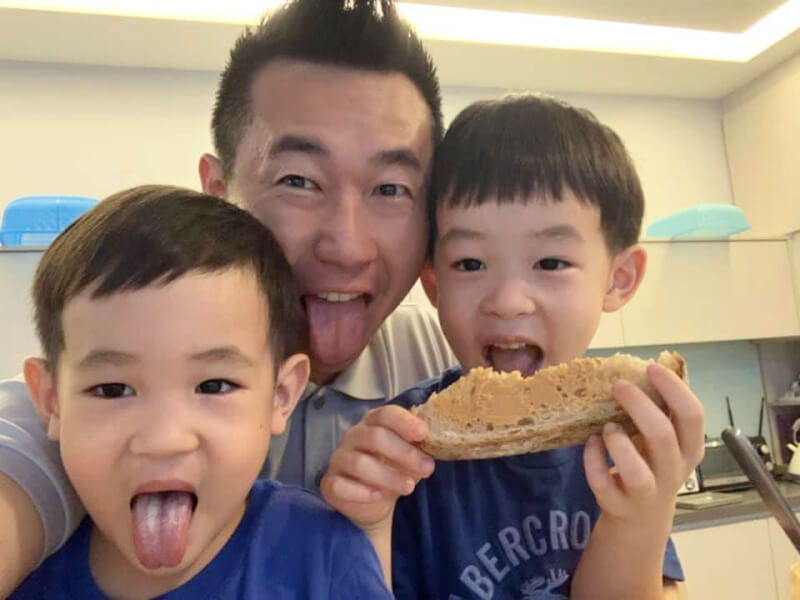 CK Chang having fun while enjoying a simple breakfast of sourdough bread with Jia Cenn and Jia Hao at home.