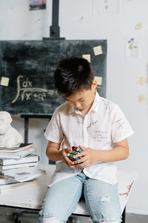 Is your child insatiably curious and asks a lot of probing questions, have an intense need for metal stimulation, likes to solve puzzles? These are some of the signs of higher intelligence. (Image Credit: Rubik’s Cube Photo by MART PRODUCTION from Pexels)