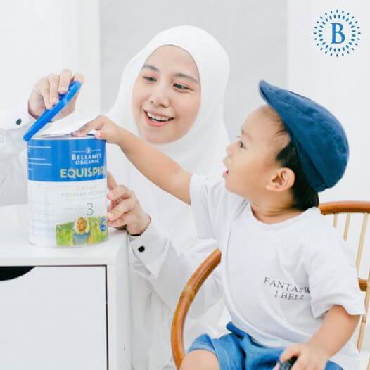 mother and son looking at the organic milk drink for toddler