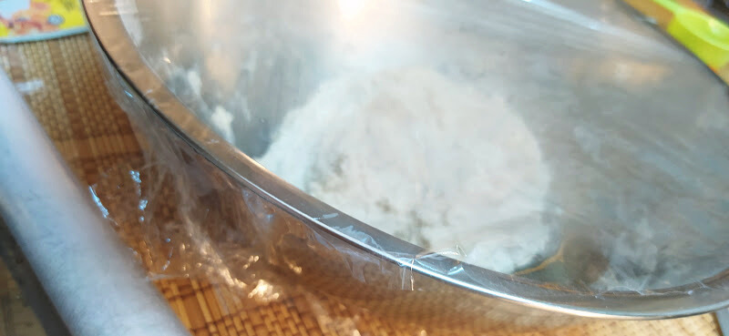 To get the dough to ferment for your Artisan Bread, Cover the bowl with cling wrap and leave it.