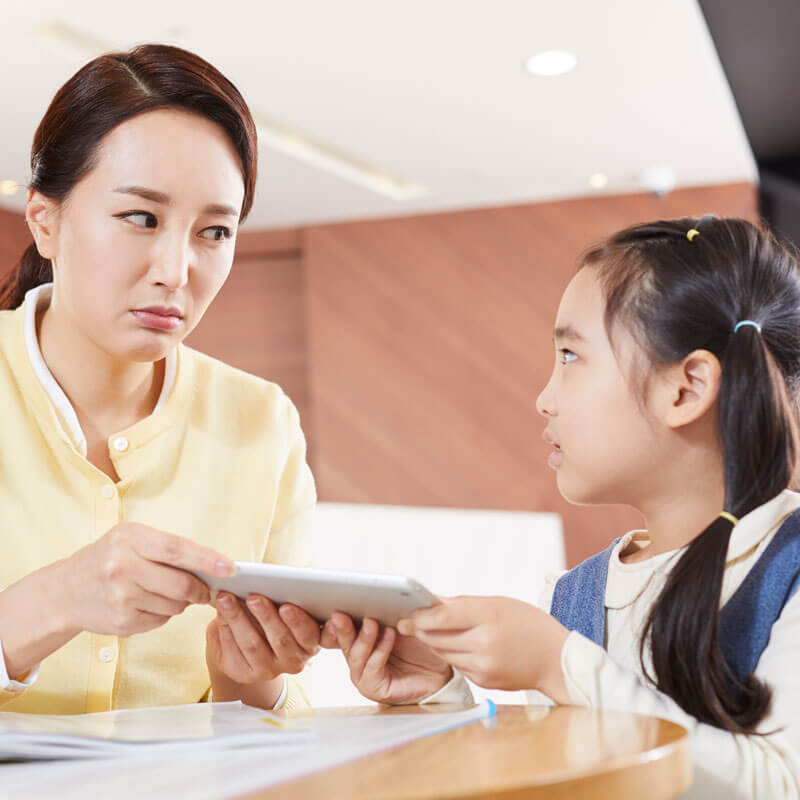 mom taking tablet away