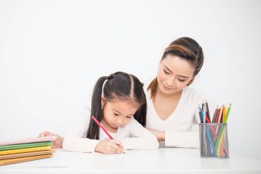 mom-teaching-daughter-handwriting