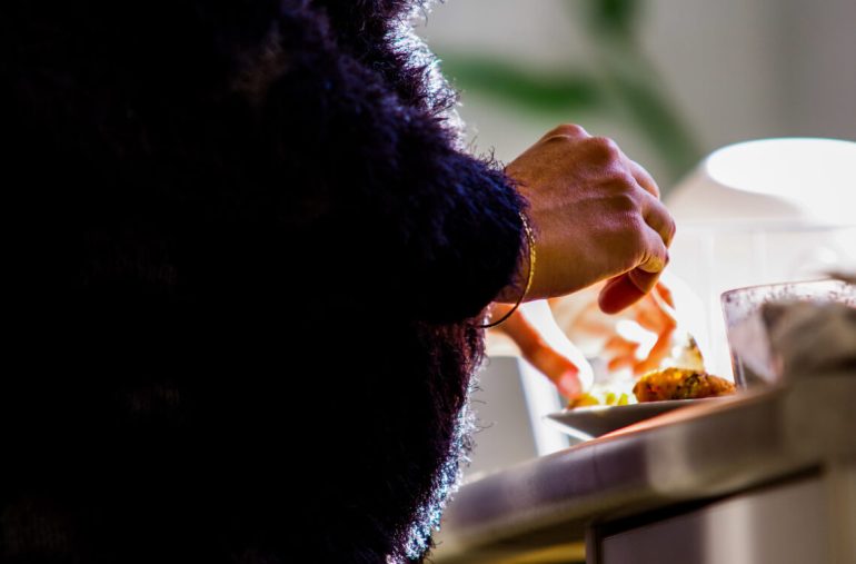 Pregnant woman enjoying a healthy chicken meal