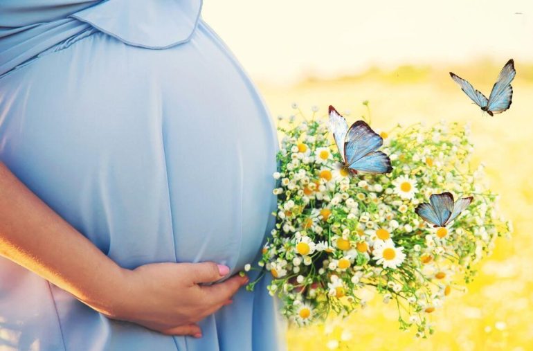 pregnant woman with herb