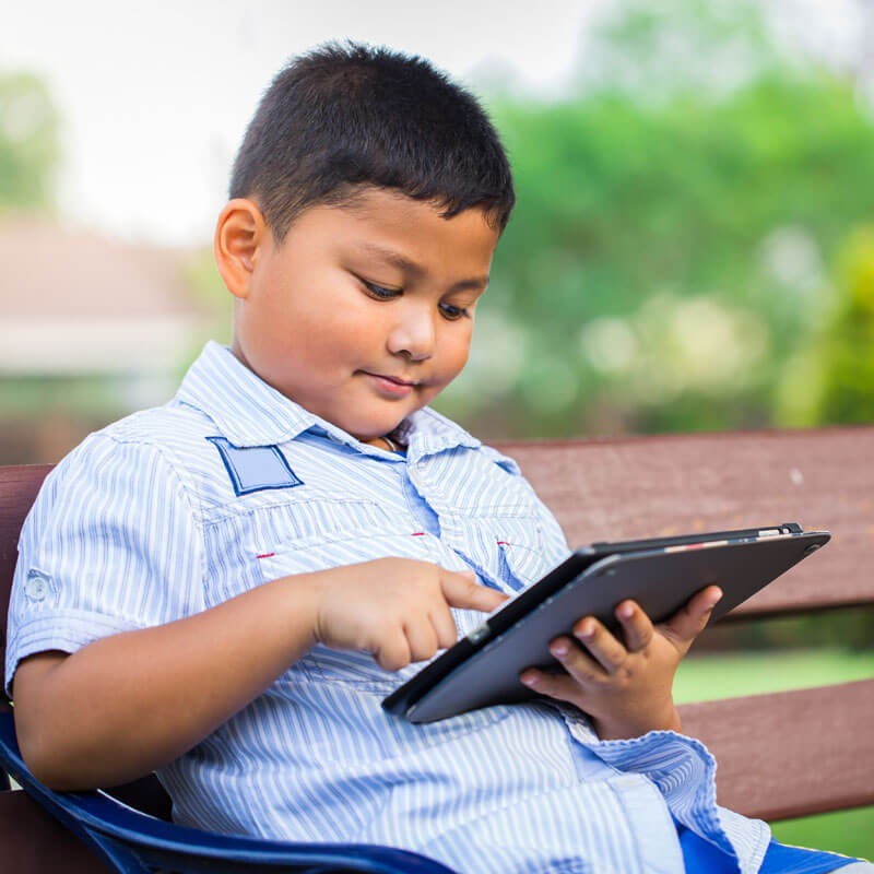 child playing with tablet