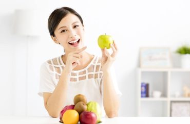 woman eating fruit
