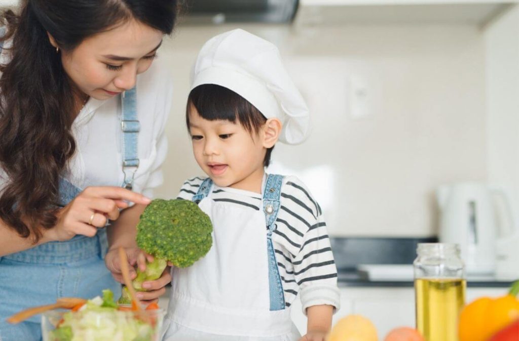 child eating vehetable