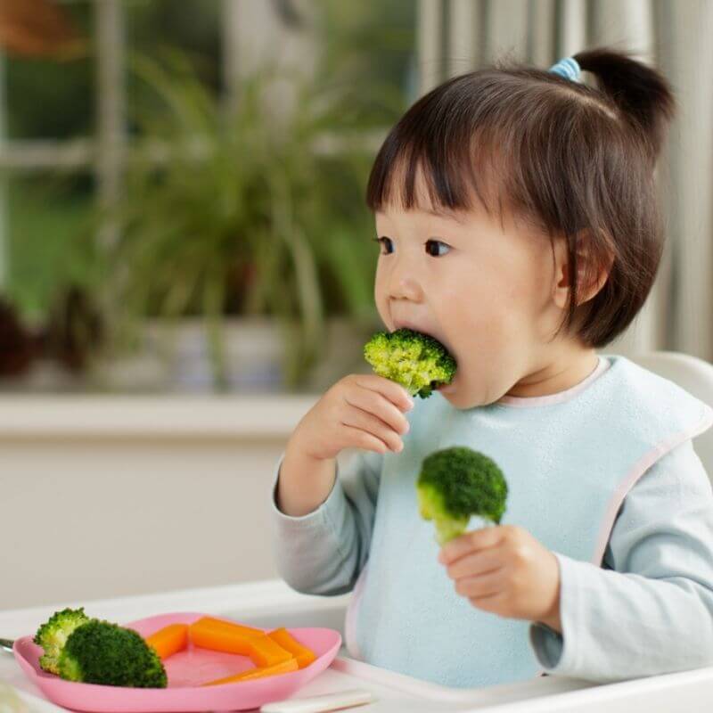 child eating vehetable