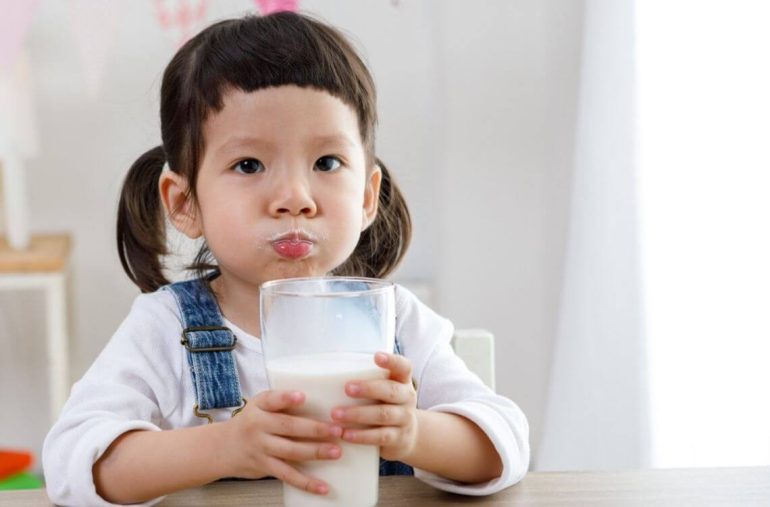 child drinking milk