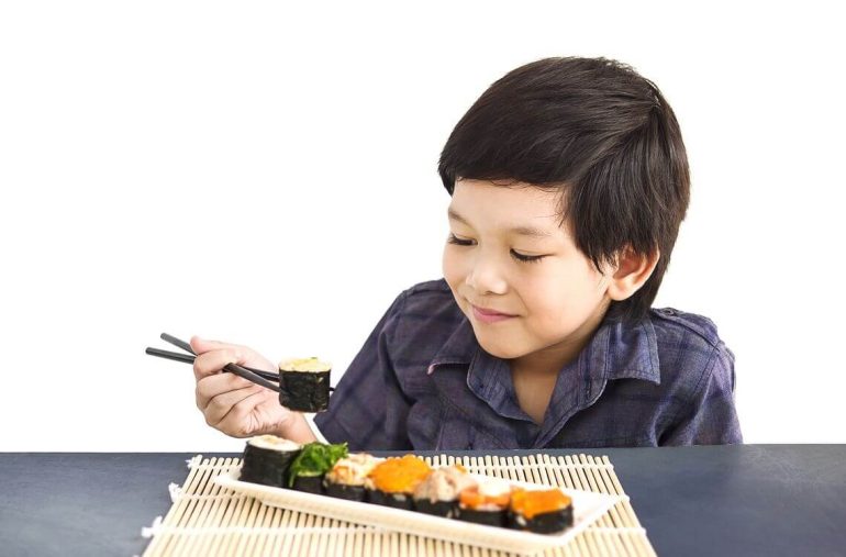 child eating sushi