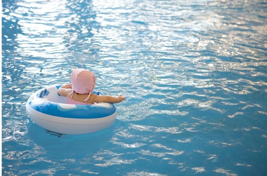 baby swimming in pool