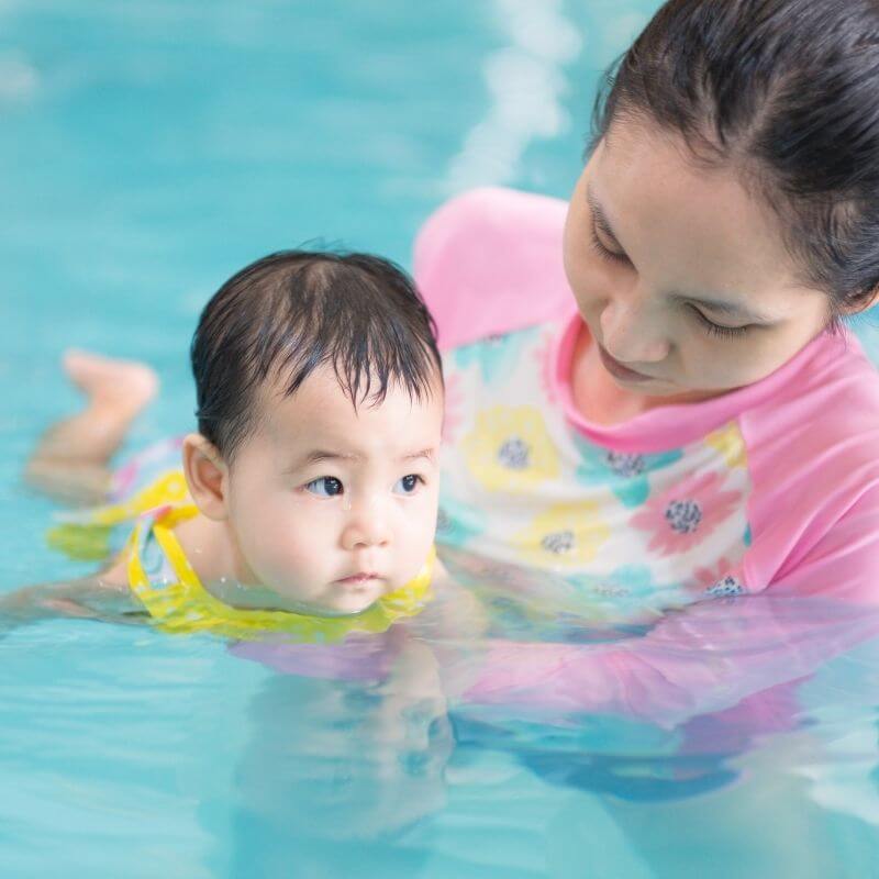 baby swimming in pool
