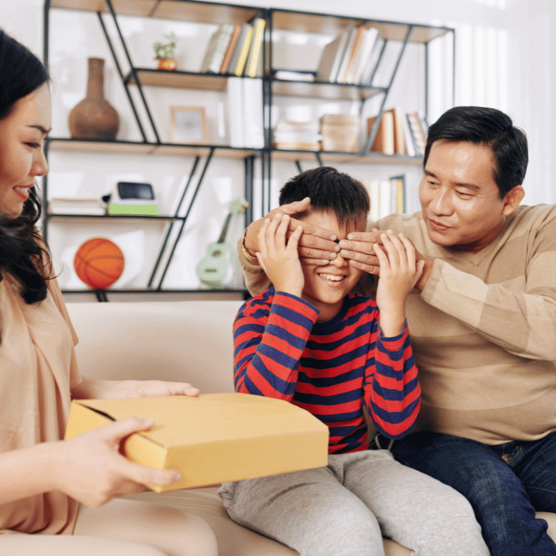 The Asian parents are rewarding their son with a surprise gift.