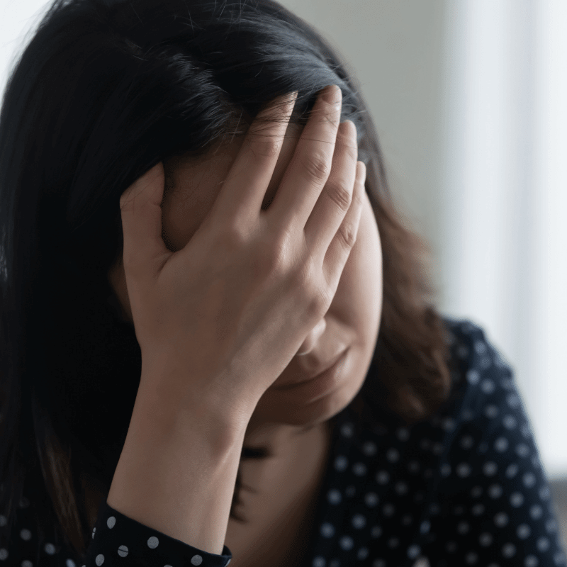 An Asian woman is feeling depressed after miscarriage.