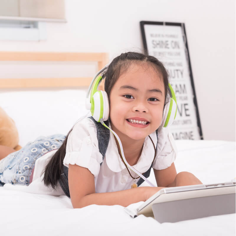 A kid is listening to an audio