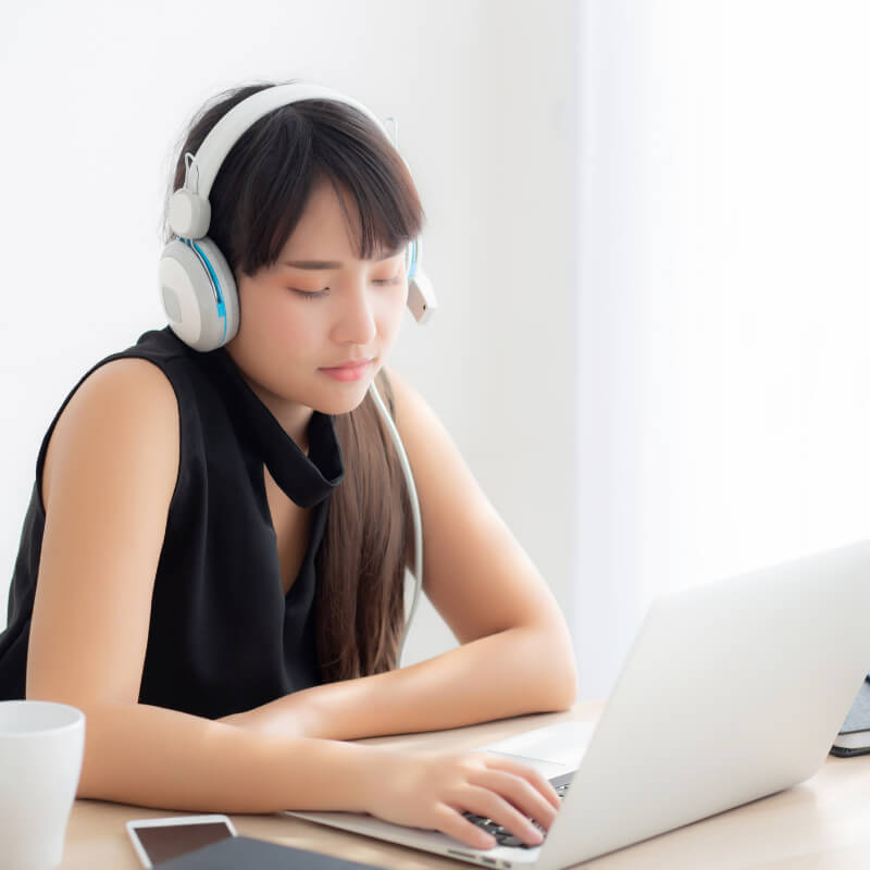 A mum listening to music while working