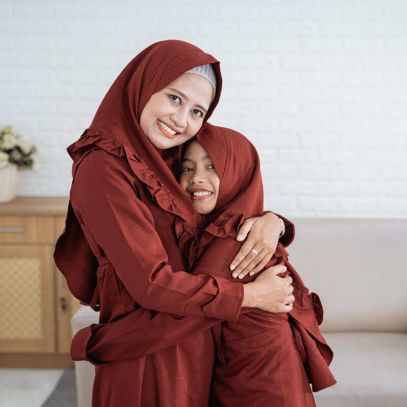 A mum hugging her daughter