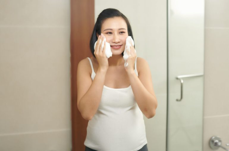 Pregnant lady doing skincare