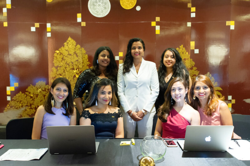 Shanggari with the girls’ side of her team in the workplace.