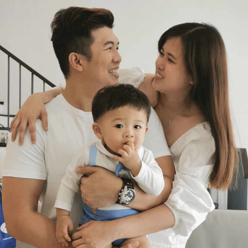 Juztyn, Jolyn and their baby boy posing happily together.