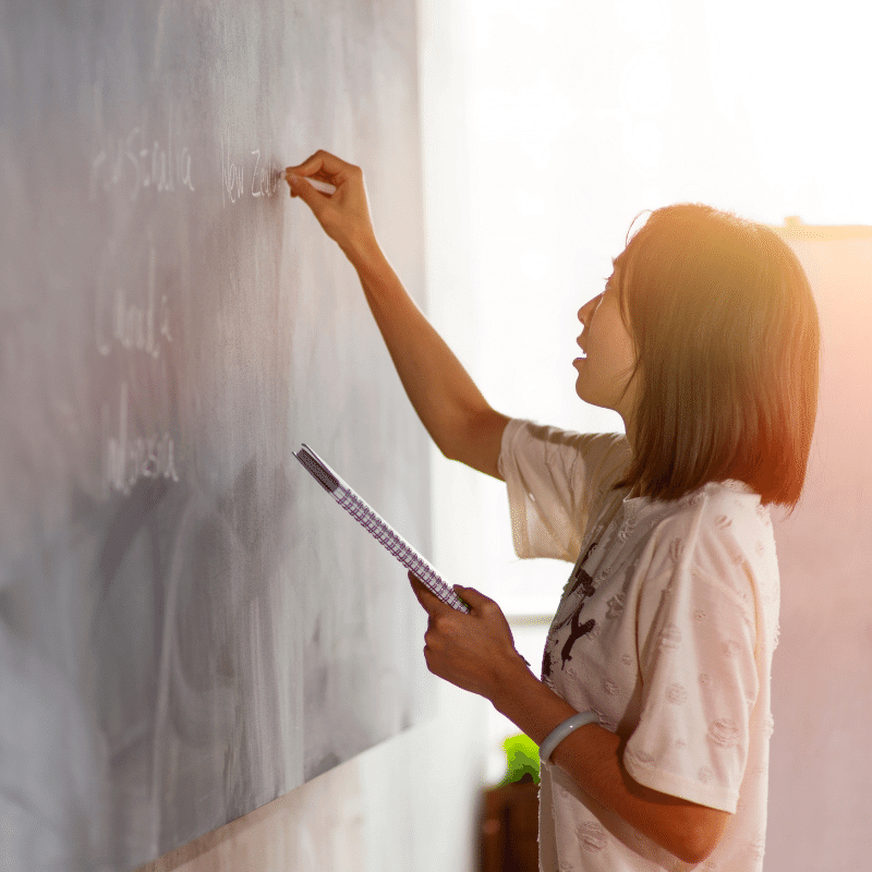 A Chinese teacher is writing on the board.