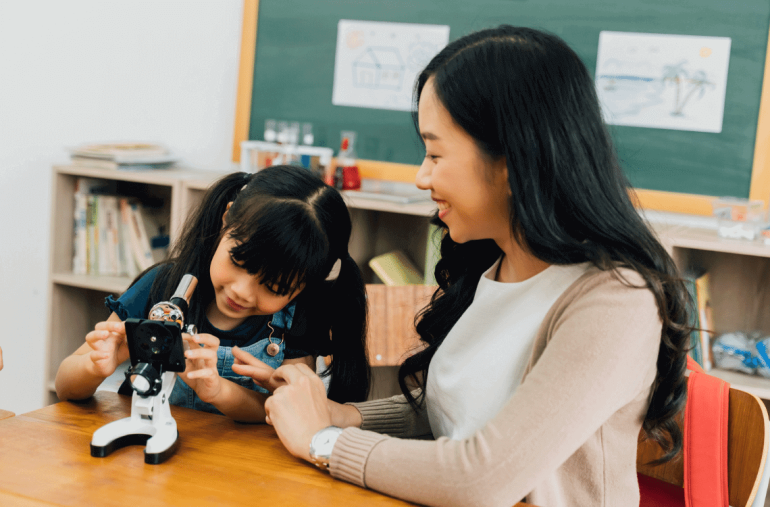 An Asian teacher is exploring with her pupils.