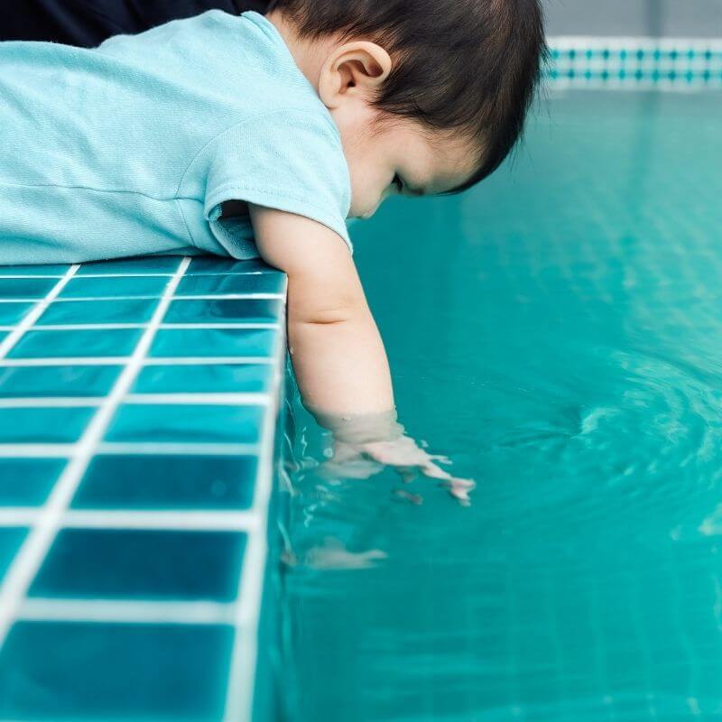 Baby near swimming pool