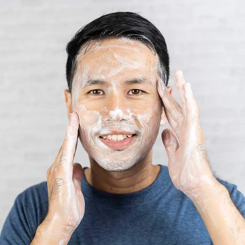 man-washing-face