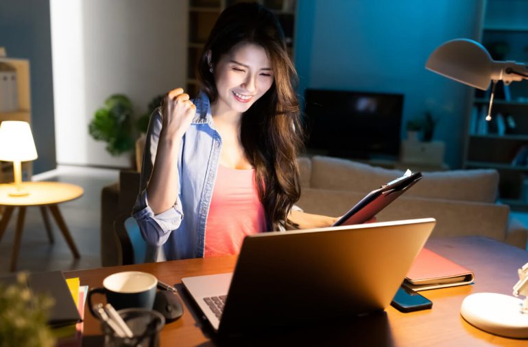 A lady looking at her laptop
