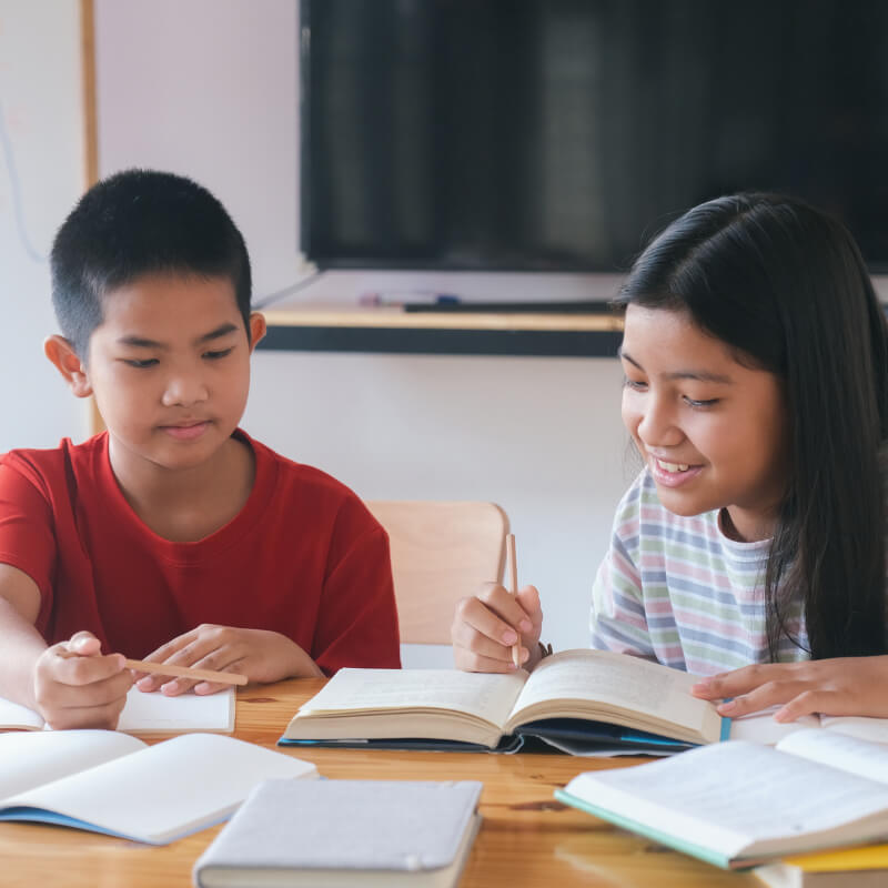 Two kids doing their homework