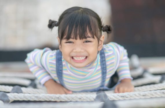 A girl climbing a net